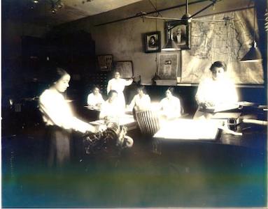 Maggie Walker and accountants using an adding machine, St. Luke's Hall, 1917.