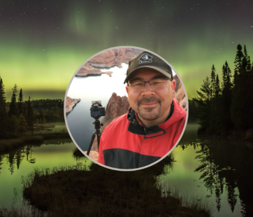 Image of photographer Travis Novitsky against a photograph of the northern lights.